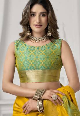 Yellow soft silk blend saree with elegant fancy pom-pom pallu 4
