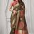 Brown soft silk saree with elegant fancy pom-pom pallu