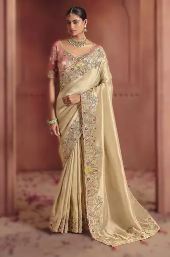 Cream elegant pure smooth zari silk saree with heavy embroidery and sequins