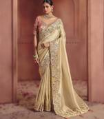 Cream elegant pure smooth zari silk saree with heavy embroidery and sequins