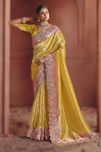 Yellow luxurious pure smooth zari silk saree with detailed thread work and sequins