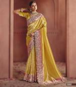 Yellow luxurious pure smooth zari silk saree with detailed thread work and sequins