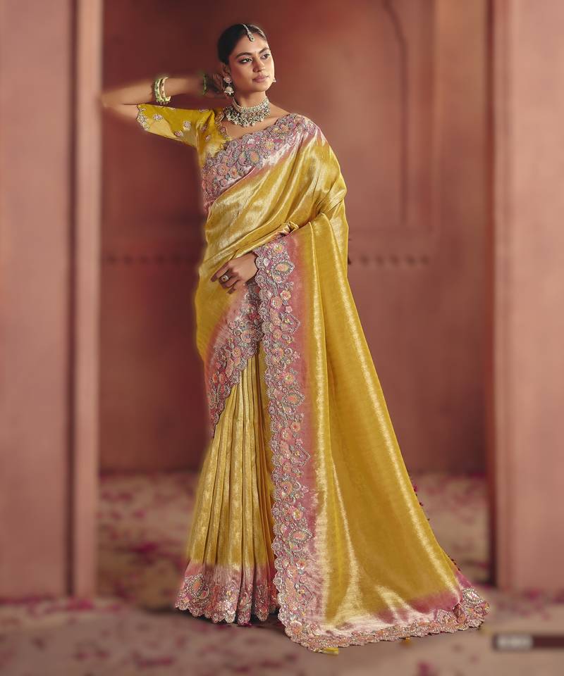 Yellow luxurious pure smooth zari silk saree with detailed thread work and sequins