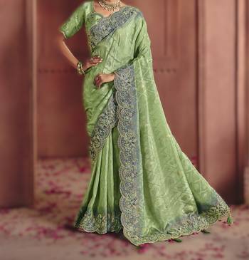 Green elegant zari dola jaquard saree with embroidery and sequins 3