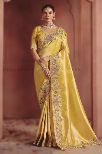 Light yellow majestic pure smooth zari silk saree with sequins and heavy embroidery