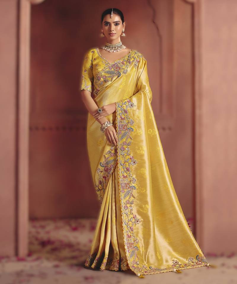 Light yellow majestic pure smooth zari silk saree with sequins and heavy embroidery
