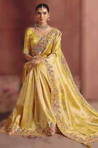 Light yellow majestic pure smooth zari silk blend saree with sequins and embroidery
