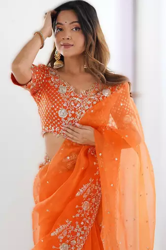 Orange organza silk blend saree with thread & sequin embroidery