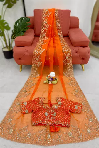 Orange organza silk blend saree with thread & sequin embroidery