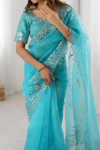 Sky blue organza silk blend saree with thread & sequin embroidery