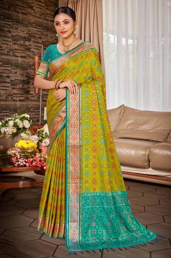 green color ethnic patola silk blend fabric beautiful festive saree