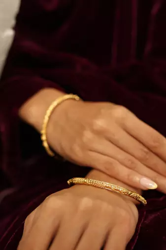 Patterned gold eternity bangles