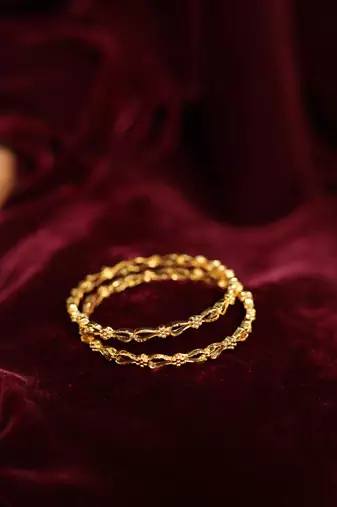 Intricate filigree gold bangles