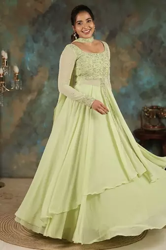 Lime green georgette slit anarkali paired with skirt and choker dupatta