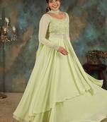 Lime green georgette slit anarkali paired with skirt and choker dupatta