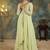 Lime green georgette slit anarkali paired with skirt and choker dupatta