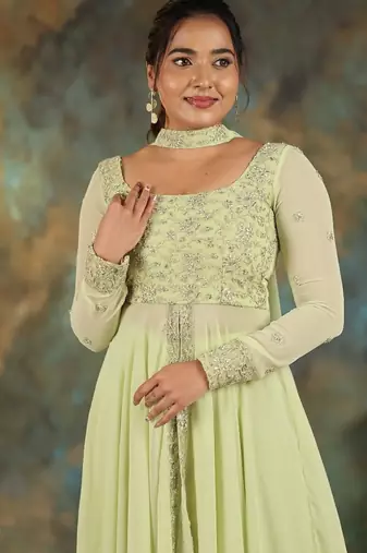 Lime green georgette slit anarkali paired with skirt and choker dupatta