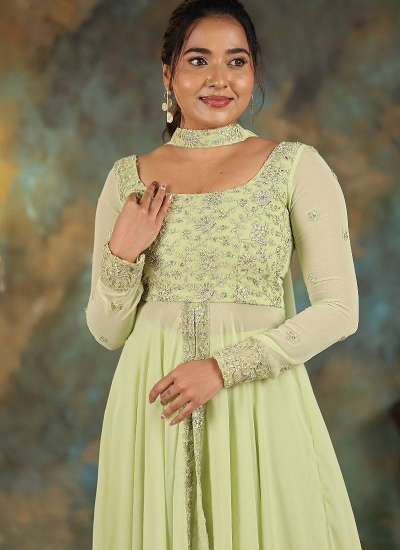 Lime green georgette slit anarkali paired with skirt and choker dupatta