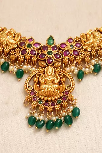 Gold plated green stones temple necklace set