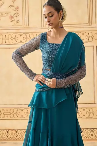 TEAL BLUE LAYERED LEHENGA WITH BEAD WORK BLOUSE AND BELT