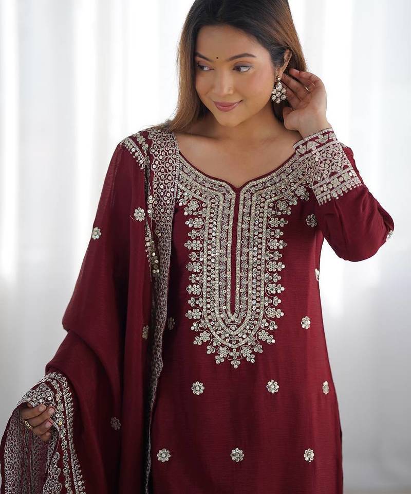 Women maroon sequins , zari, coding & thread embroidered work silk kurta set