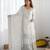 Women white sequins , zari, coding & thread embroidered work silk kurta set