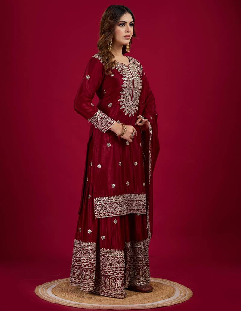 Women maroon sequins , zari, coding & thread embroidered work silk kurta set