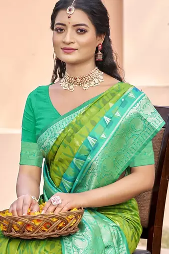 l green silk saree with blouse piece