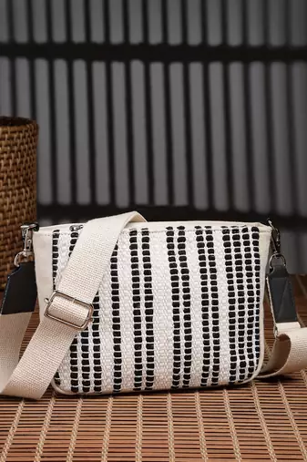 Anekaant earth edit off white & black jacquard striped sling bag