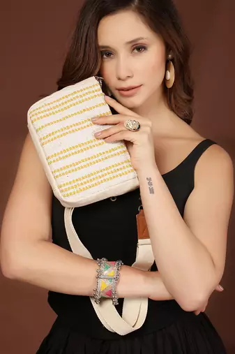 Anekaant earth edit off white & mustard jacquard striped sling bag