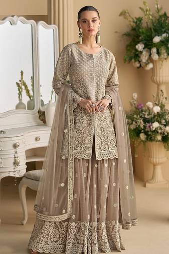 Beige color net embroidered palazzo suit 
