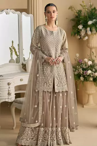 Beige color net embroidered palazzo suit 
