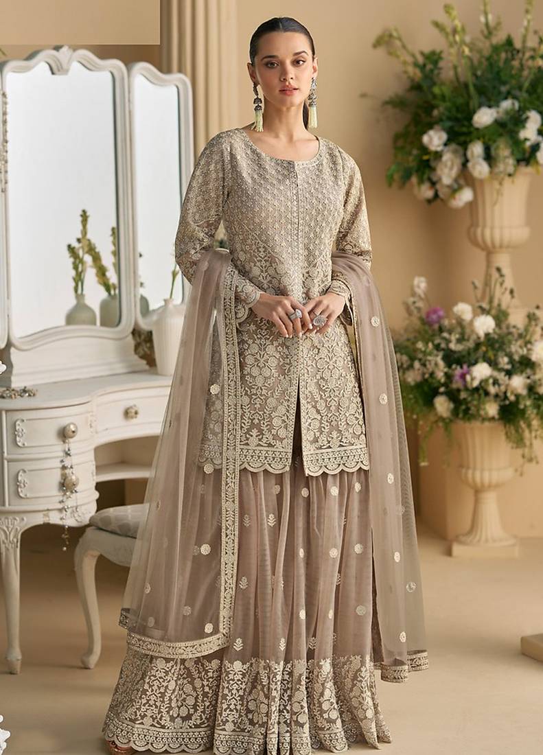 Beige color net embroidered palazzo suit 