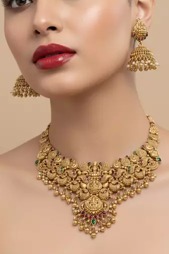 Traditional handcrafted gold-plated temple necklace set with jhumka earrings | ethnic bridal jewelry