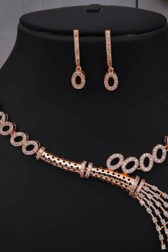Traditional handcrafted rose gold-plated cz necklace set with oval motifs & tassel design