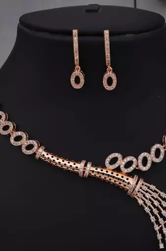 Traditional handcrafted rose gold-plated cz necklace set with oval motifs & tassel design