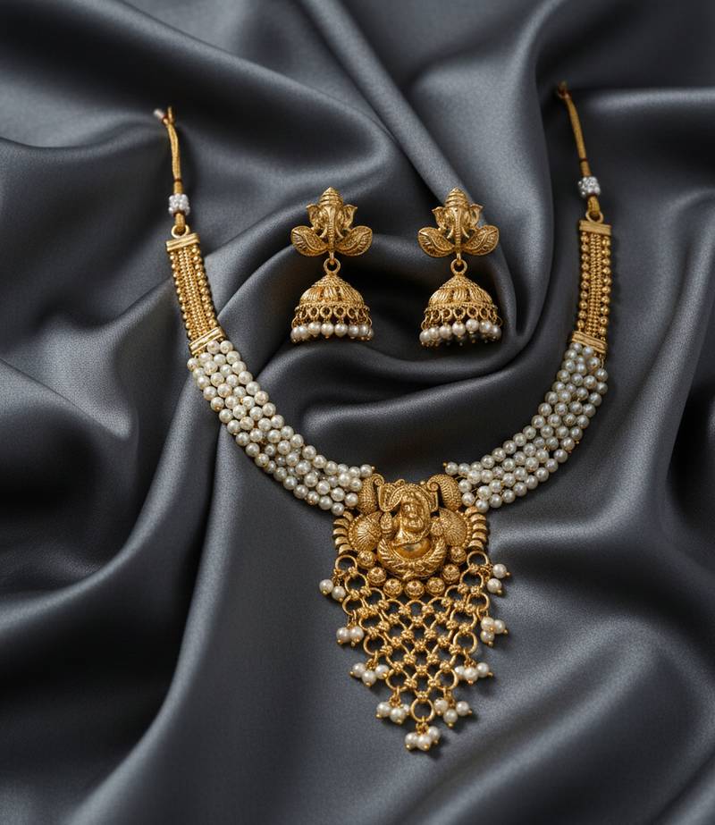 Traditional gold-plated lord ganesha pearl choker necklace set with jhumka earrings – handcrafted ethnic bridal jewelry