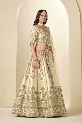 cream embroidered art silk blend lehenga choli with net dupatta