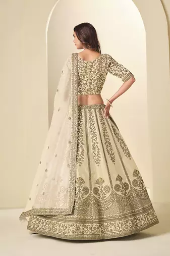 cream embroidered art silk blend lehenga choli with net dupatta