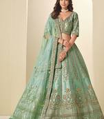 green embroidered art silk lehenga choli with matching dupatta