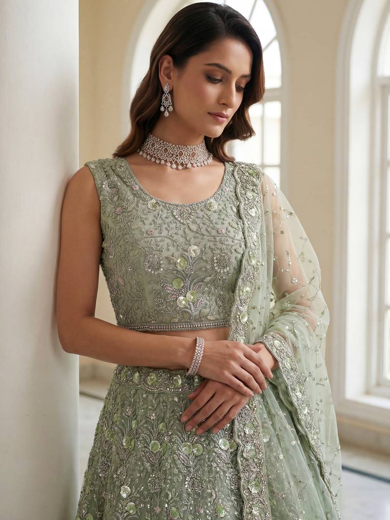 Beautiful Sea Green Embroidered Net Reception Wear Lehenga Choli
