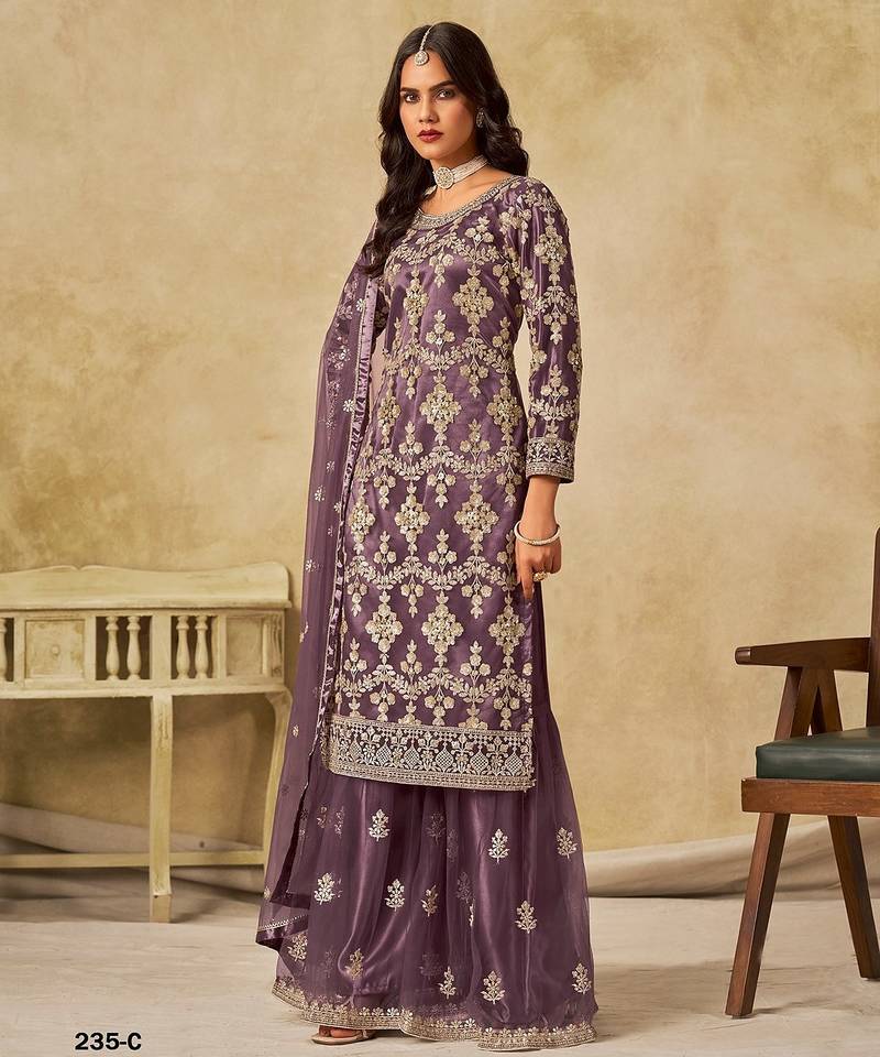 Purple embroidered net salwar suits 