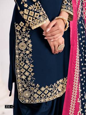 Green silk embroidered salwar suits  3