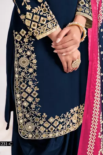 Green silk embroidered salwar suits 