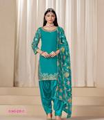 Green silk embroidered salwar suits 