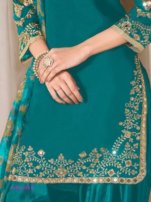 Green silk embroidered salwar suits  3