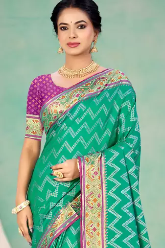 emerald green patola silk blend woven work traditional saree