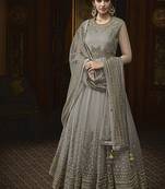 Soft net anarkali party wear salwar kameez in grey color with embroidery and crystal stone work