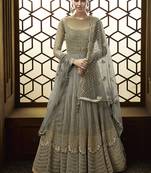 Soft net anarkali party wear salwar kameez in grey color with embroidery and crystal stone work