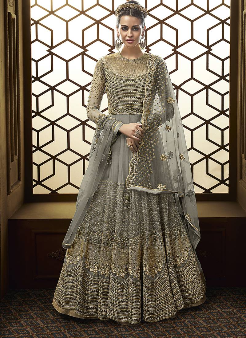 Soft net anarkali party wear salwar kameez in grey color with embroidery and crystal stone work